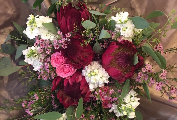 A red, pink, and white bouquet of flowers
